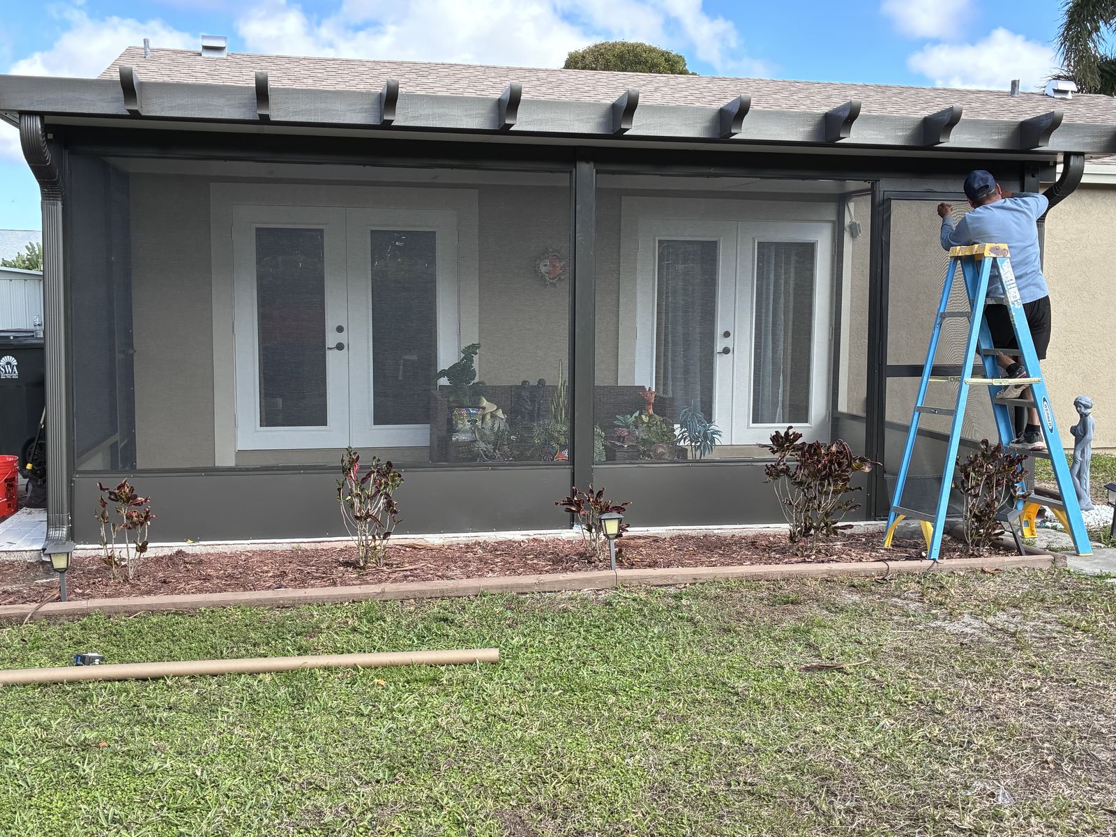 Installing a screen enclosure on a South Florida patio